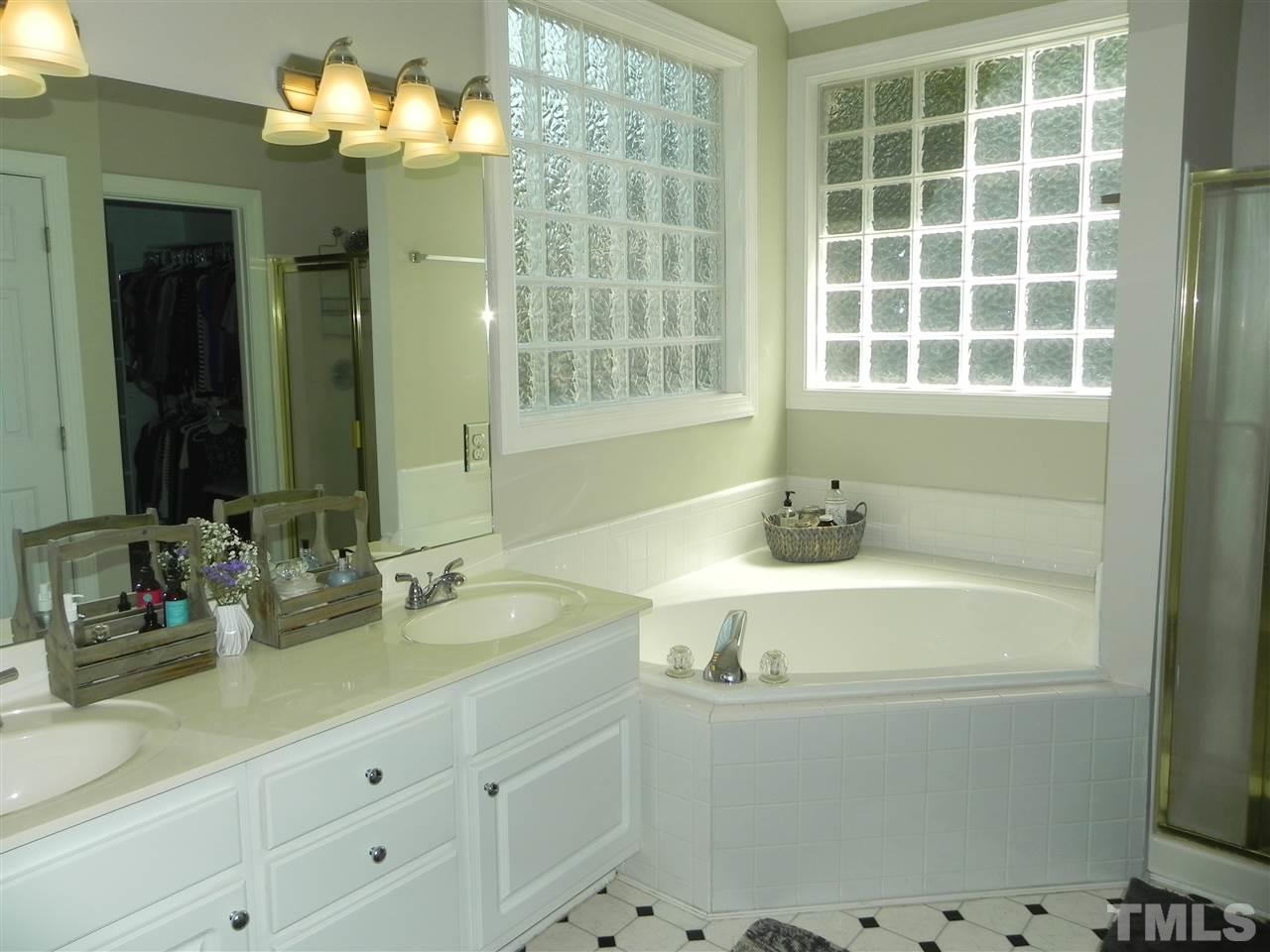 4115 Breadfruit Court Raleigh, NC 27616 - Photo 14 of 25 Dual Cultured Marble Vanities w/Garden Soaking Tub, Separate Shower, Water Closet, and Walk-In Closet