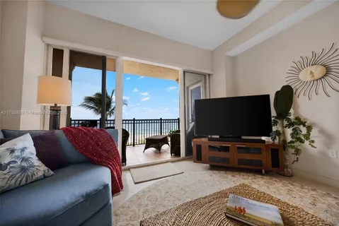 a kitchen with stainless steel appliances granite countertop a sink a stove and a microwave