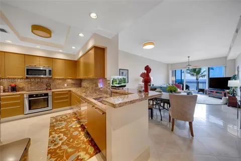 a kitchen with stainless steel appliances granite countertop sink and cabinets