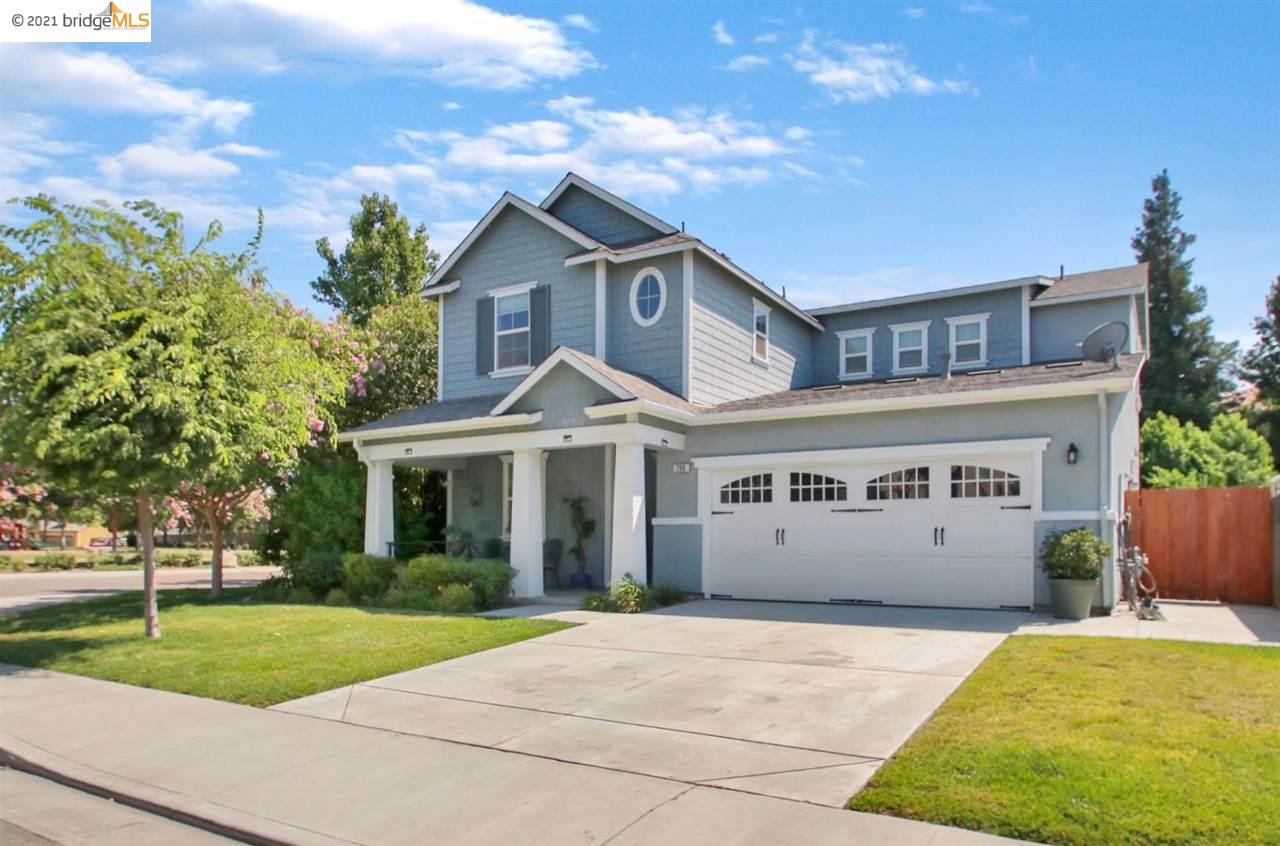 a large building with a tree in front of it