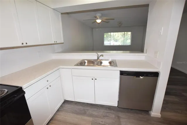 a bathroom with a sink vanity and mirror