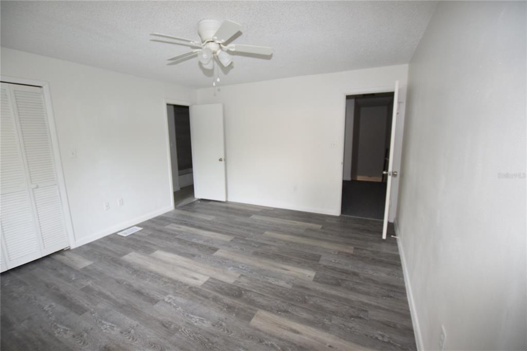 904 Sumter Street Leesburg, FL 34748 - Photo 26 of 27 a view of empty room with a ceiling fan