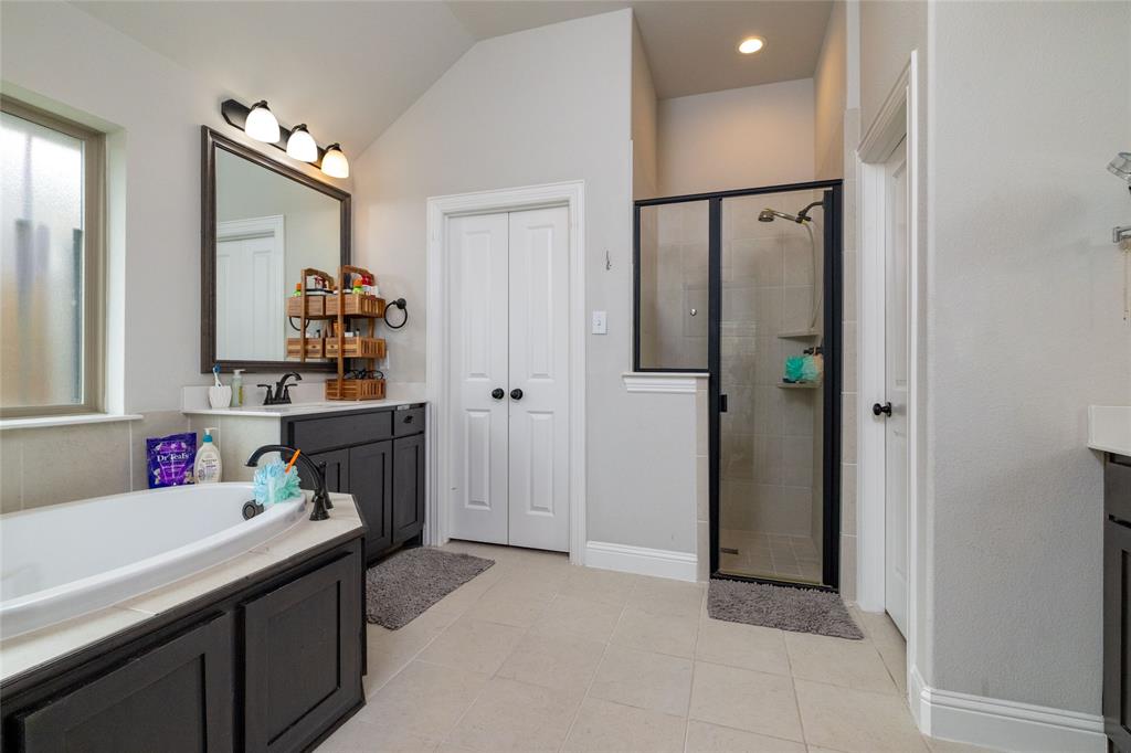 4045 Grove Valley Road Midlothian, TX 76065 - Photo 23 of 34 Bathroom featuring a stall shower, a garden tub, vanity, light tile patterned flooring, and recessed lighting