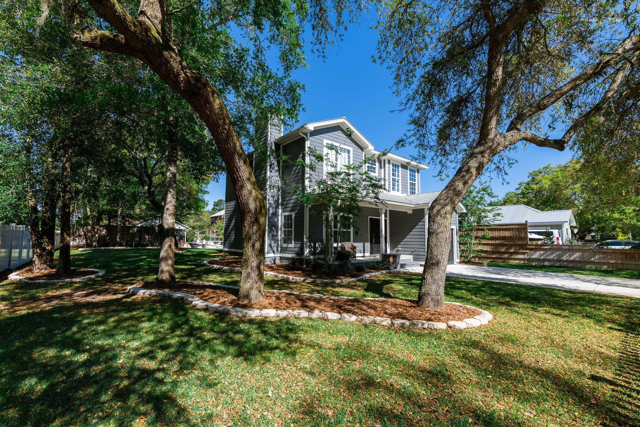 2275 Mack Bayou Road Santa Rosa Beach, FL 32459 - Photo 6 of 20 a view of a house with backyard and tree