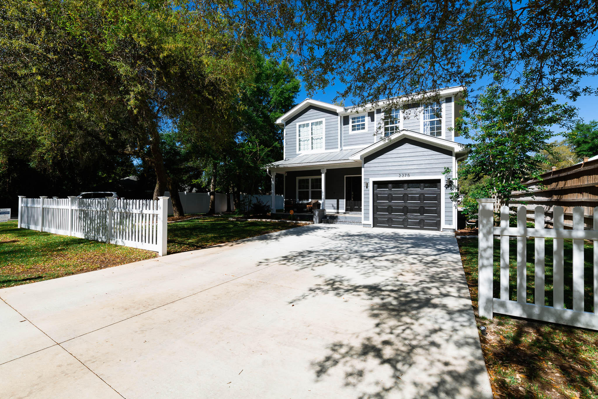 2275 Mack Bayou Road Santa Rosa Beach, FL 32459 - Photo 8 of 20 a front view of a house with a yard and garage