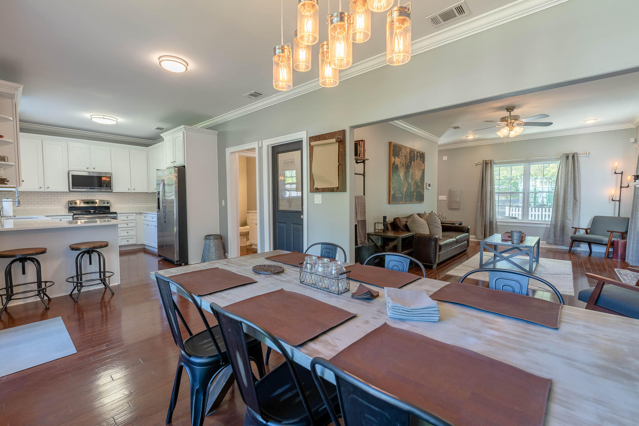 2275 Mack Bayou Road Santa Rosa Beach, FL 32459 - Photo 9 of 20 a view of a dining room with furniture window and wooden floor