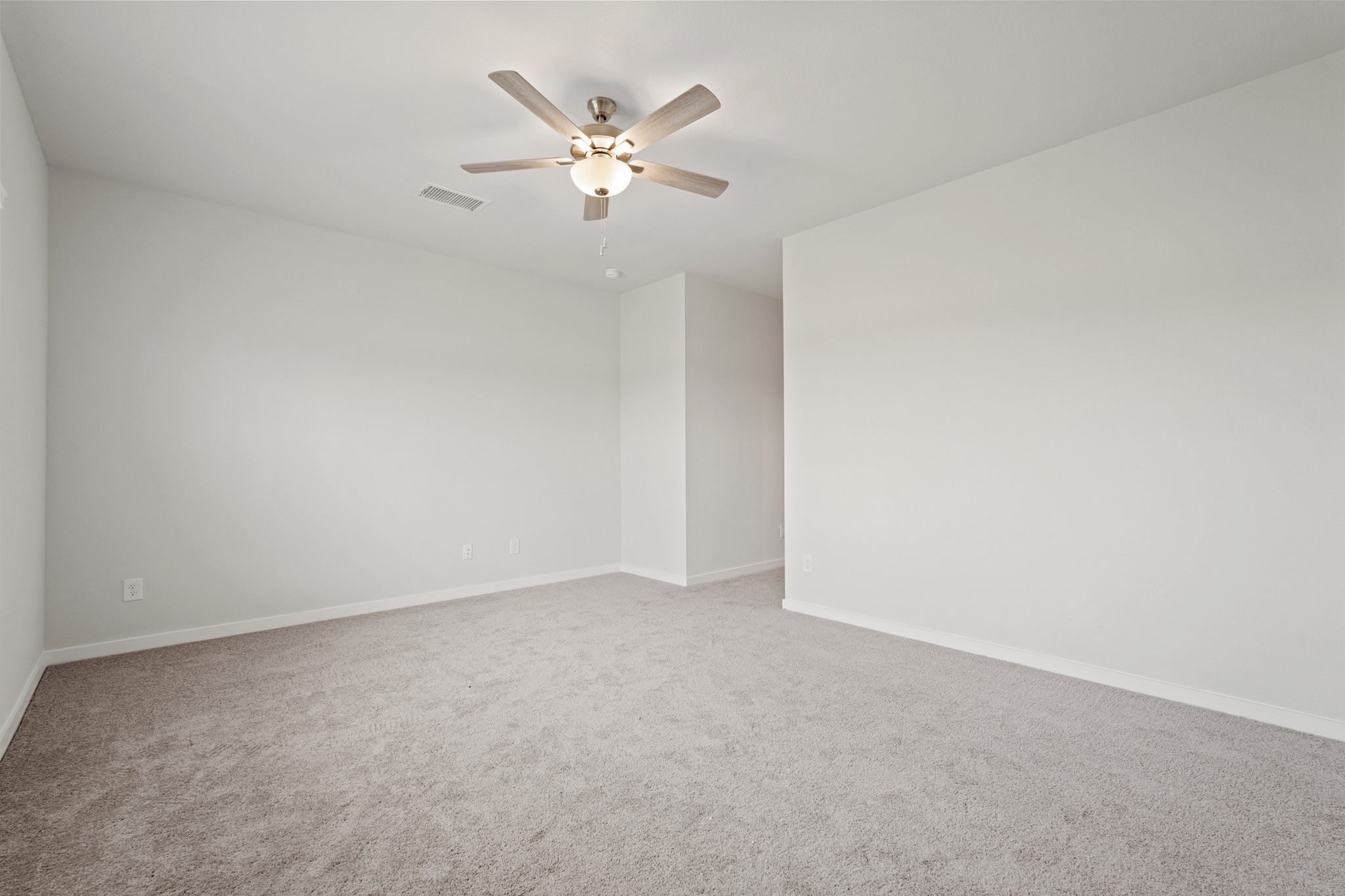 217 Spring Drive Hockley, TX 77447 - Photo 12 of 24 an empty room with a chandelier fan