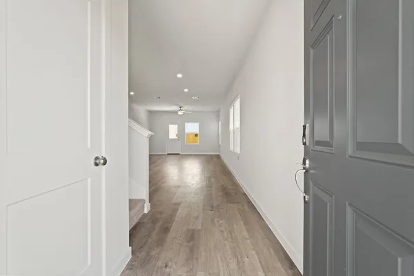 a view of gallery with wooden floor