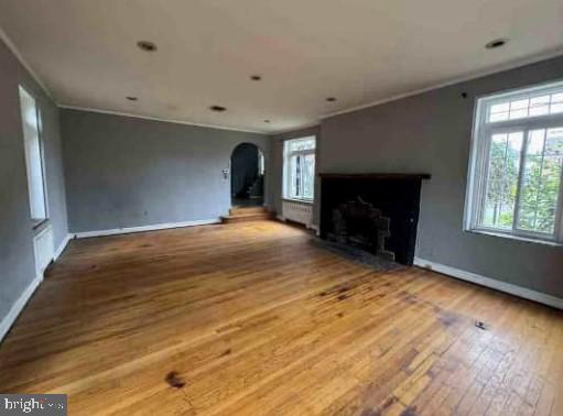 2820 Hillcrest Road Drexel Hill, PA 19026 - Photo 3 of 9 a view of an empty room with a fireplace and a window