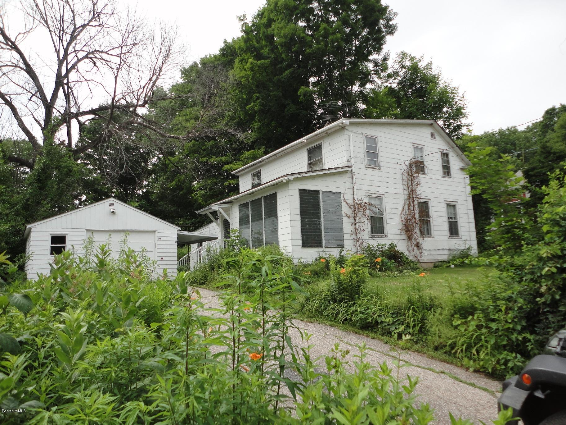 19 Swamp Road West Stockbridge, MA 01266 - Photo 1 of 12 a view of a white house with a yard and potted plants