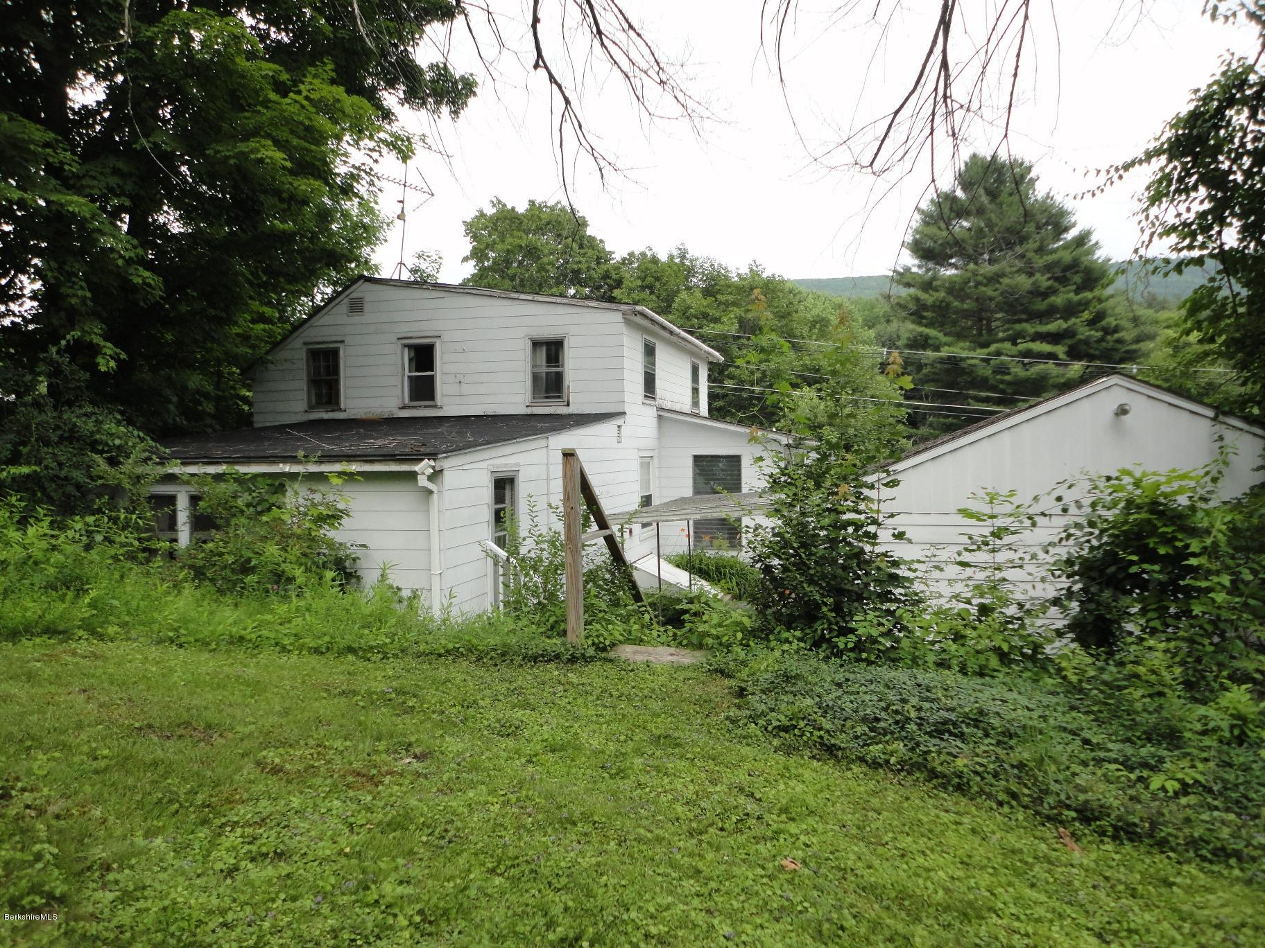 19 Swamp Road West Stockbridge, MA 01266 - Photo 3 of 12 a aerial view of a house with yard and trees in the background