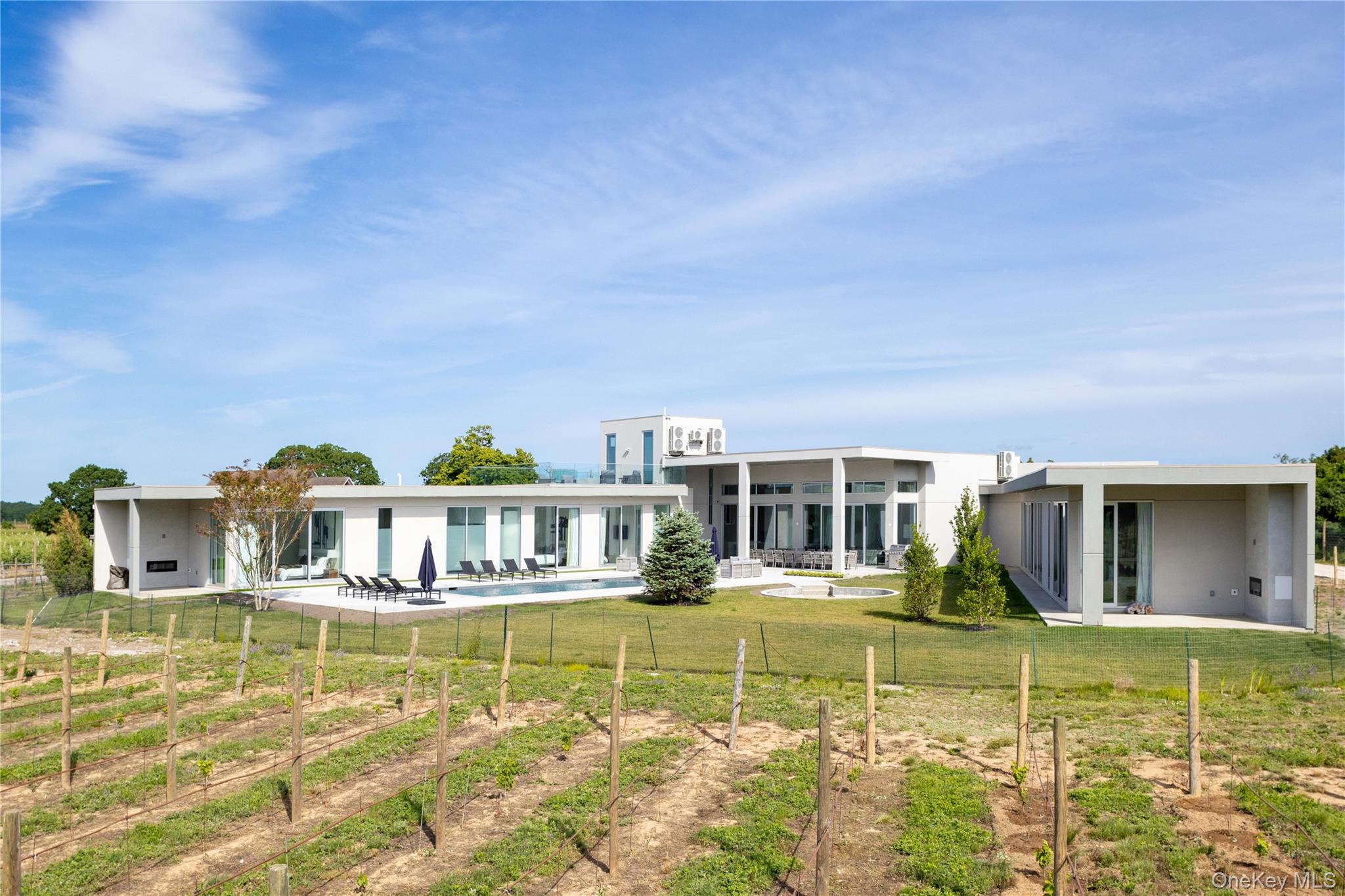 15105 Oregon Road Cutchogue, NY 11935 - Photo 17 of 24 a view of a house with swimming pool