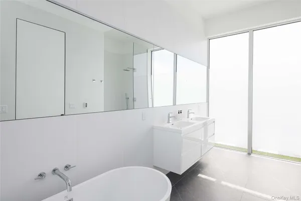 a bathroom with a sink a toilet and tub