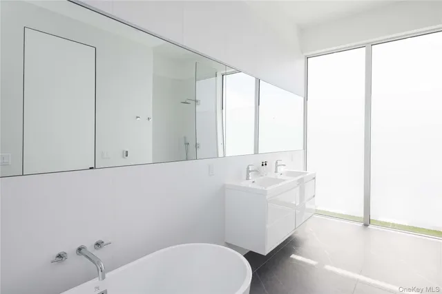 a bathroom with a sink a toilet and tub