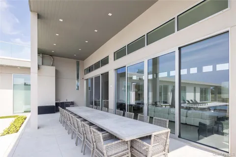 a outdoor space with a tub and glass door