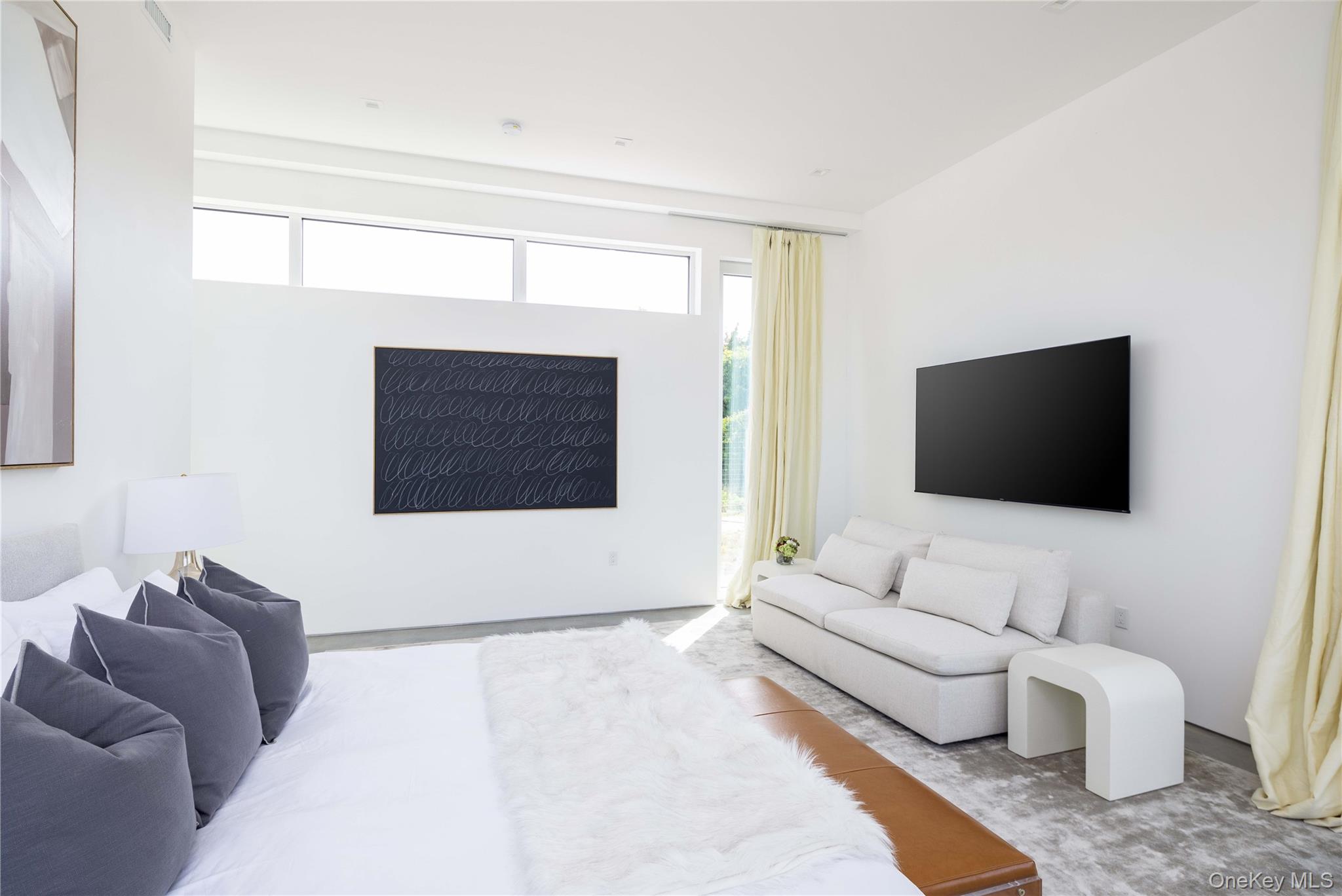 15105 Oregon Road Cutchogue, NY 11935 - Photo 8 of 24 a living room with furniture and a flat screen tv