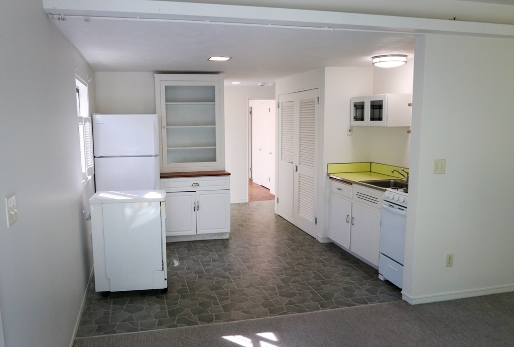 583 Gay Street, Unit A Westwood, MA 02090 - Photo 5 of 14 a bathroom with a sink and a mirror