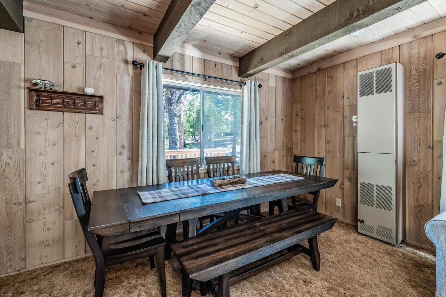 41277 Timber Drive Shaver Lake, CA 93664 - Photo 12 of 24 a view of a dining room with furniture window and wooden floor