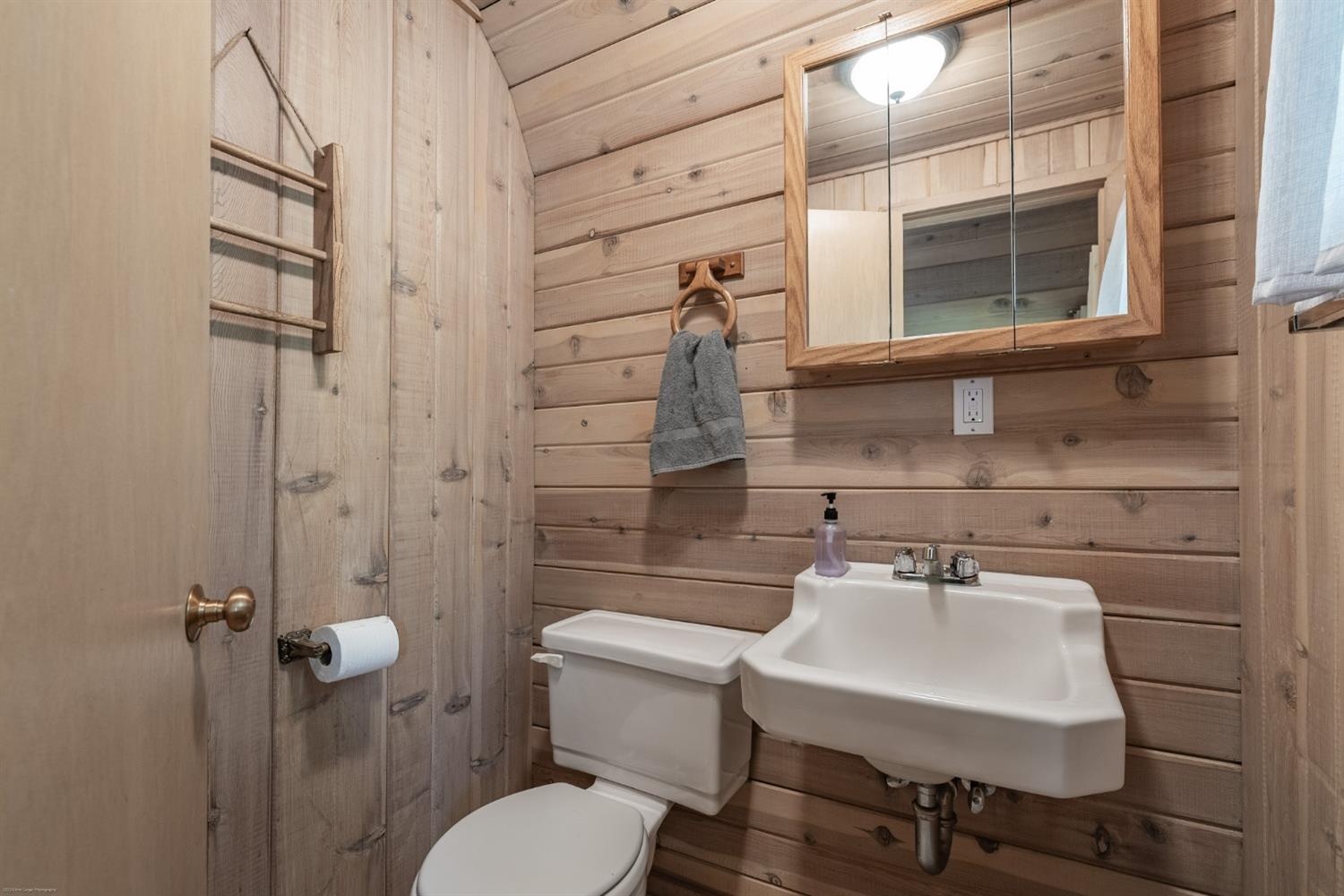41277 Timber Drive Shaver Lake, CA 93664 - Photo 20 of 24 a bathroom with a sink a toilet and shower