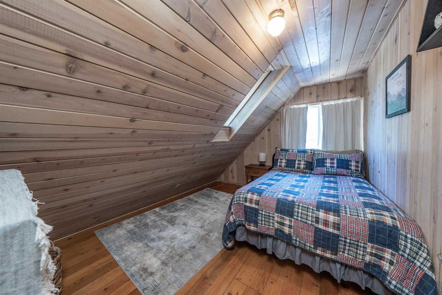 41277 Timber Drive Shaver Lake, CA 93664 - Photo 21 of 24 a bedroom with a bed and a table