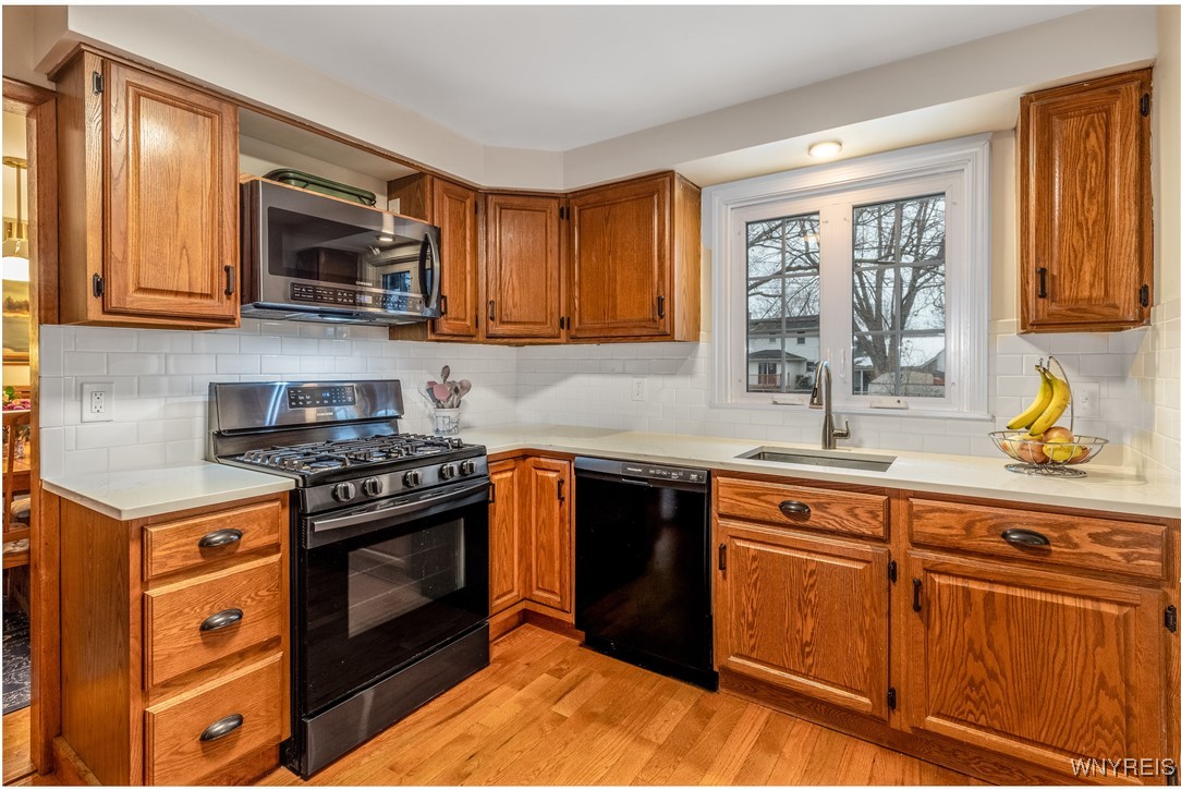 390 Brookshire Road Porter, NY 14174 - Photo 18 of 50 The kitchen features new Corian countertops, subwa