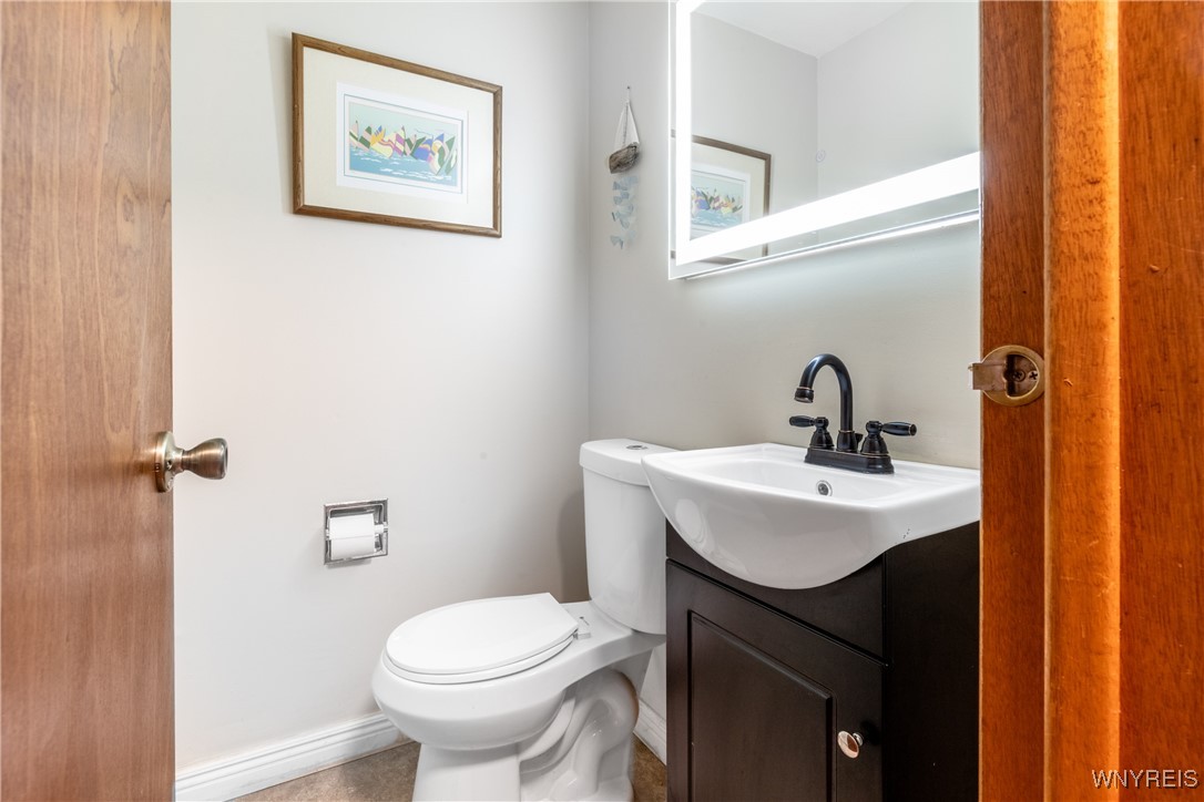 390 Brookshire Road Porter, NY 14174 - Photo 25 of 50 A well-placed first-floor half bath offers easy ac