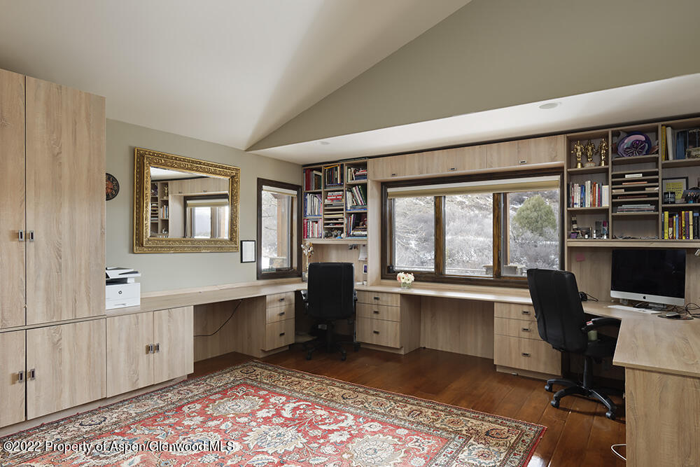 2345 Juniper Hill Road Aspen, CO 81611 - Photo 11 of 26 a view of a workspace with furniture and a window