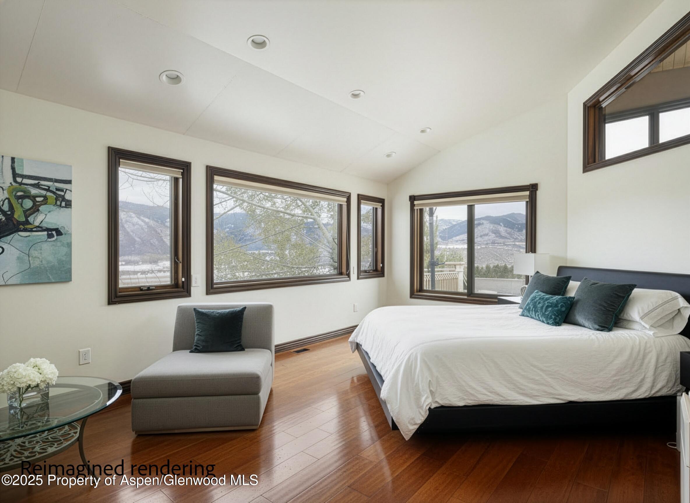 2345 Juniper Hill Road Aspen, CO 81611 - Photo 14 of 26 a bedroom with a bed and wooden floor