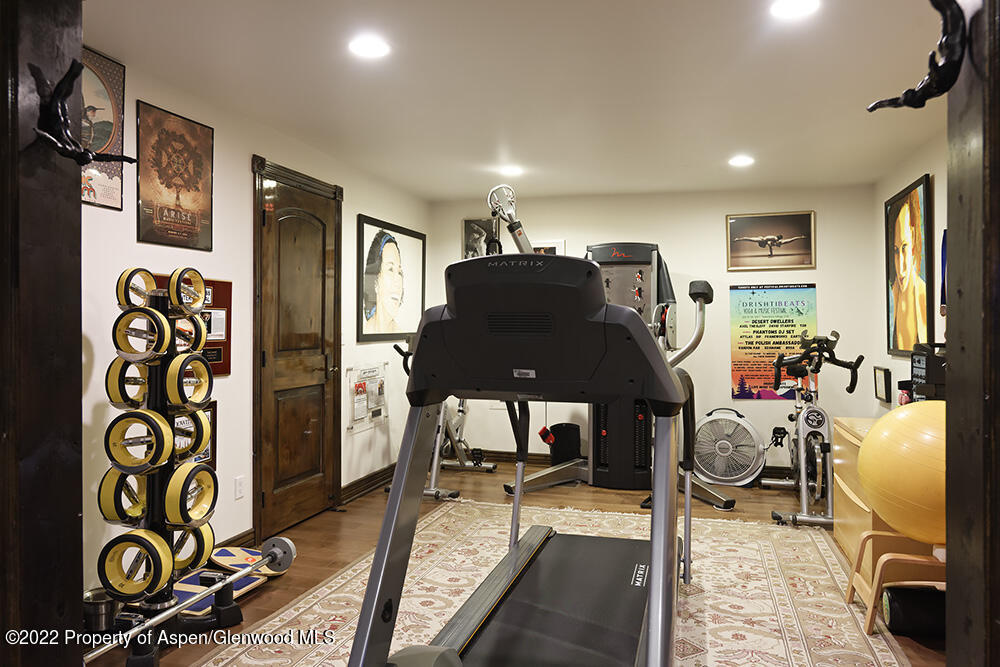 2345 Juniper Hill Road Aspen, CO 81611 - Photo 24 of 26 a living room with furniture and a flat screen tv
