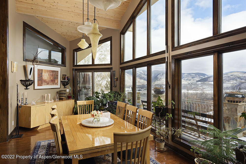 2345 Juniper Hill Road Aspen, CO 81611 - Photo 5 of 26 a view of a dining room with furniture window and outside view