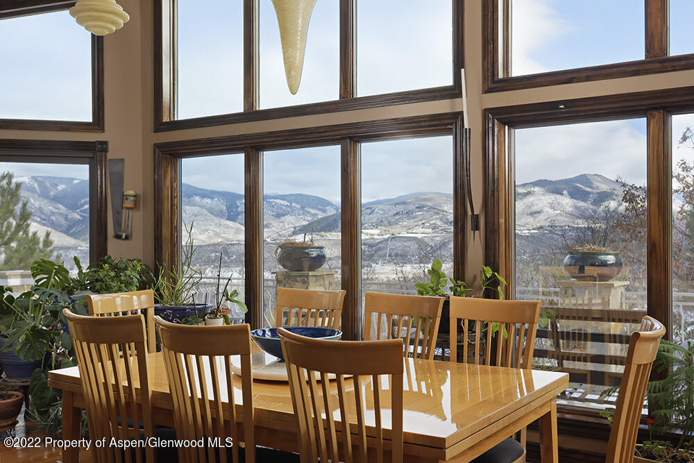 2345 Juniper Hill Road Aspen, CO 81611 - Photo 6 of 26 a view of a city from a balcony with furniture