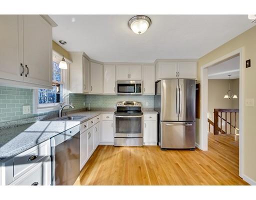 161 Fay Road Framingham, MA 01702 - Photo 2 of 14 a kitchen with a refrigerator and a stove top oven