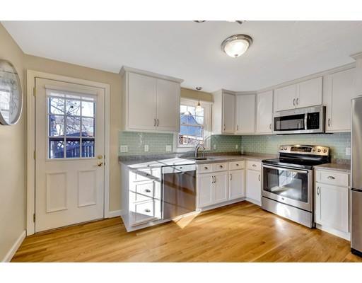161 Fay Road Framingham, MA 01702 - Photo 3 of 14 a kitchen with stainless steel appliances granite countertop a stove top oven a sink a counter space and cabinets