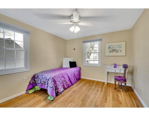 161 Fay Road Framingham, MA 01702 - Photo 7 of 14 a bedroom with a bed and a chandelier
