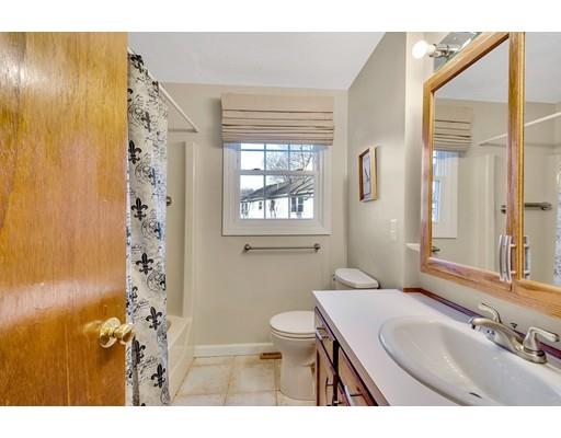 161 Fay Road Framingham, MA 01702 - Photo 8 of 14 a bathroom with a sink a toilet and a mirror