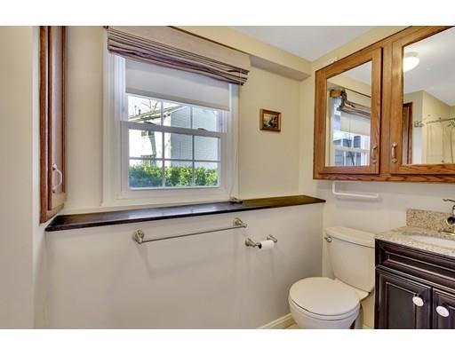 161 Fay Road Framingham, MA 01702 - Photo 10 of 14 a bathroom with a toilet sink a mirror and a shower