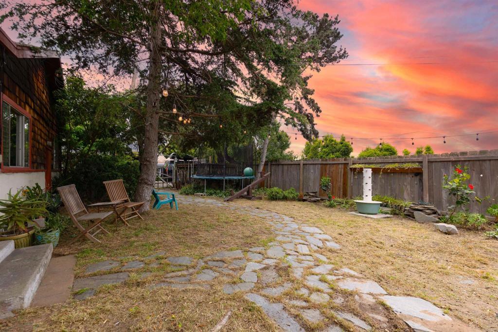605 Normandy Road Encinitas, CA 92024 - Photo 1 of 1 a backyard of a house with barbeque oven and outdoor seating