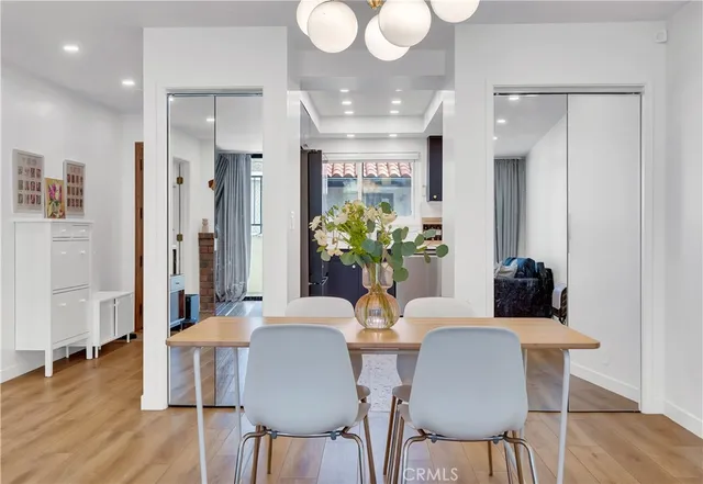 a view of a dining room with furniture and wooden floor