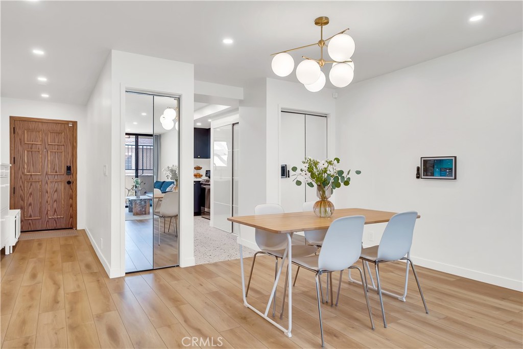 745 Main Street, Unit 107 El Segundo, CA 90245 - Photo 14 of 40 a view of a dining room with furniture and wooden floor