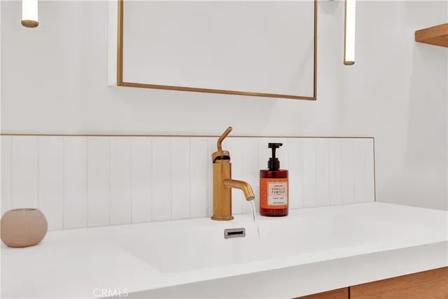 a bathroom with a sink and a window