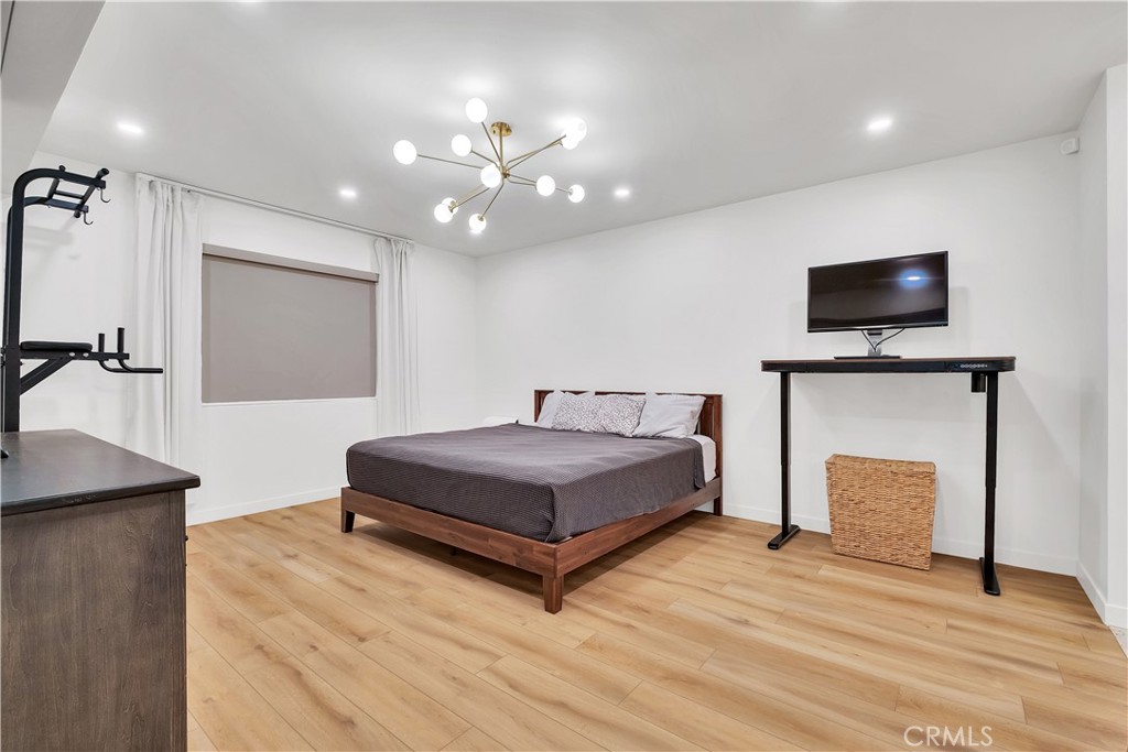 745 Main Street, Unit 107 El Segundo, CA 90245 - Photo 23 of 40 a bedroom with a bed and a flat screen tv