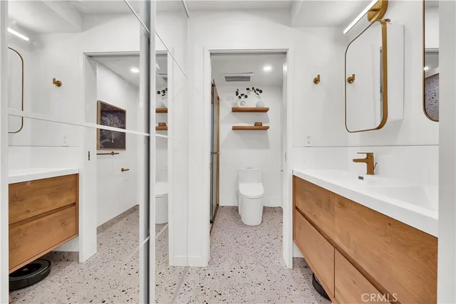 a bathroom with a bathtub shower sink and toilet