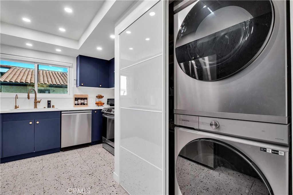 745 Main Street, Unit 107 El Segundo, CA 90245 - Photo 6 of 40 a kitchen with a refrigerator and a sink