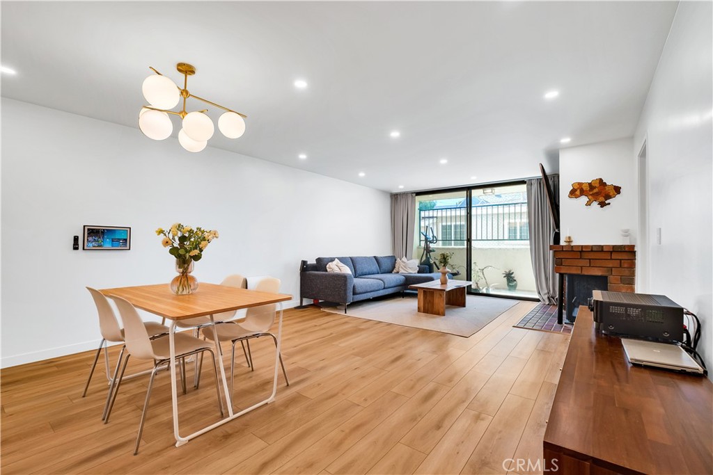 745 Main Street, Unit 107 El Segundo, CA 90245 - Photo 8 of 40 a living room with furniture and a wooden floor