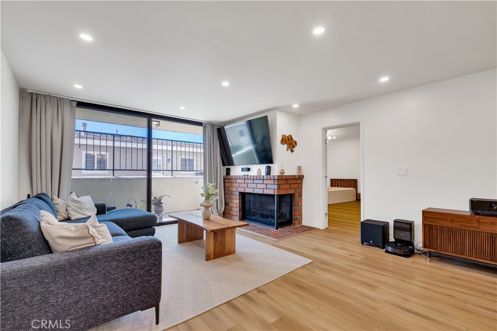 745 Main Street, Unit 107 El Segundo, CA 90245 - Photo 9 of 40 a living room with furniture and a fireplace