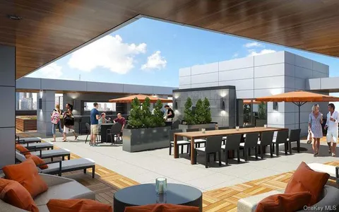 a outdoor space with patio lots of furniture and chandelier