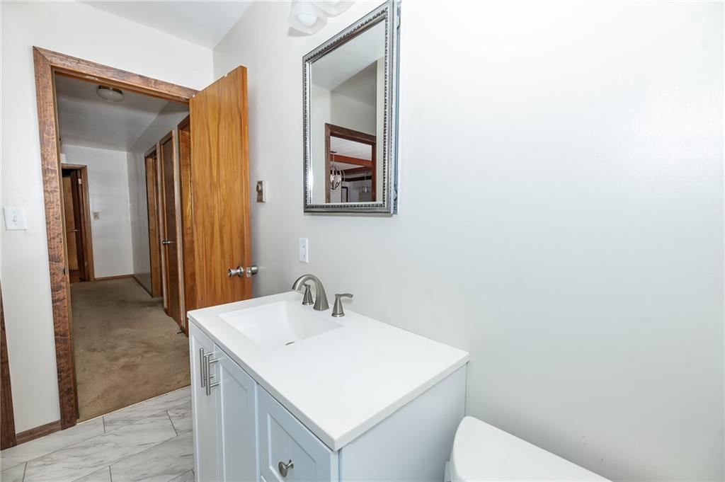 225 Courtland Road Indiana, PA 15701 - Photo 19 of 38 a bathroom with a toilet sink and mirror