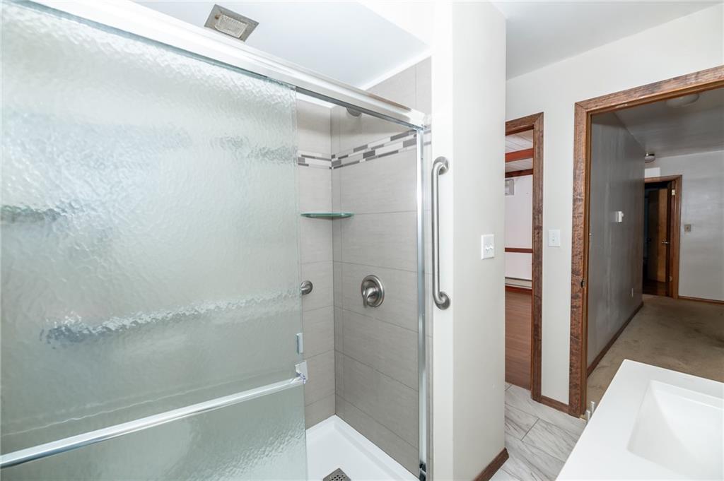 225 Courtland Road Indiana, PA 15701 - Photo 20 of 38 a bathroom with a glass shower door