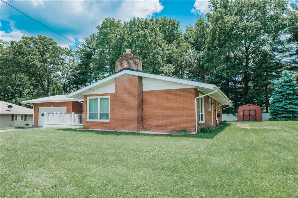 225 Courtland Road Indiana, PA 15701 - Photo 2 of 38 a house view with a barn in the background