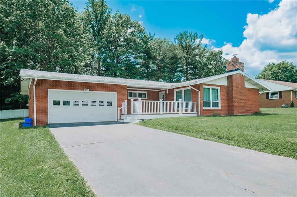 225 Courtland Road Indiana, PA 15701 - Photo 3 of 38 a view of a house with a yard and garage